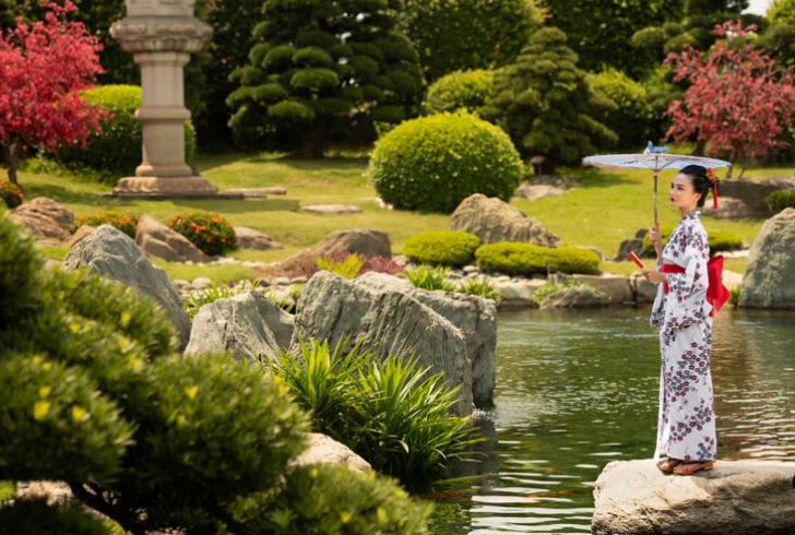 Woman walking peacefully in Japanese garden