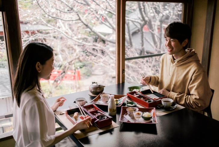 Happy Japanese people eating food